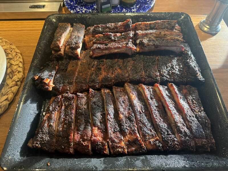 Tray of smoked ribs prepared by Island Que Smokers
